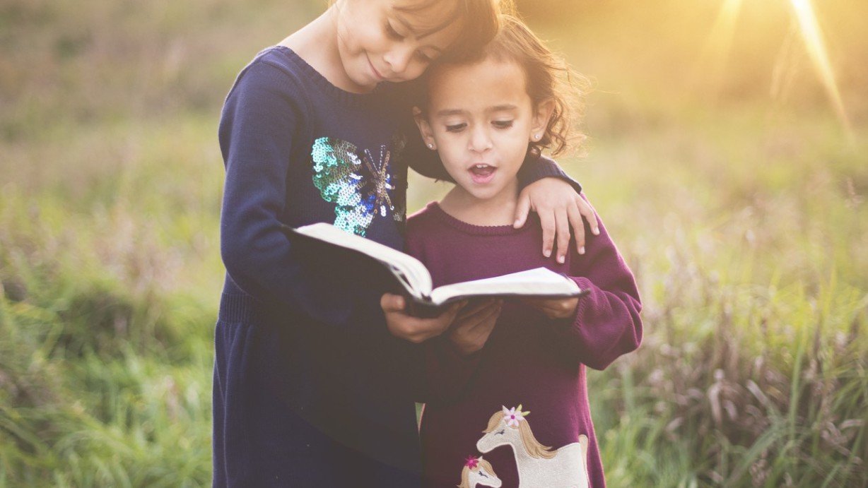 Resources For Children 6 Young girls reading the Bible together